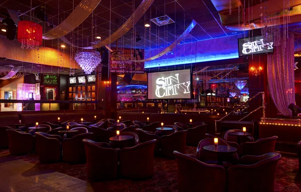 VIP lounge seating arranged under accent lighting