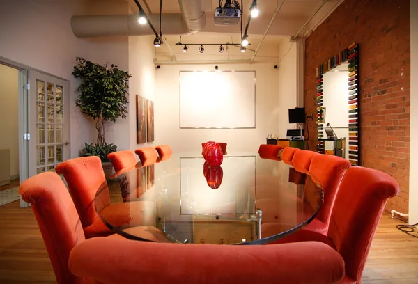 Company reception with logo wall behind the desk