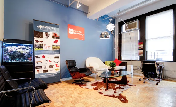 Standing desks arranged along the window line