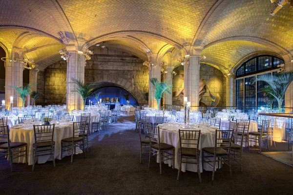 Outdoor event lawn with seating under string lights