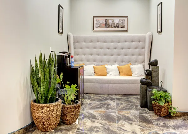 Doctor's private office with bookshelves and diplomas