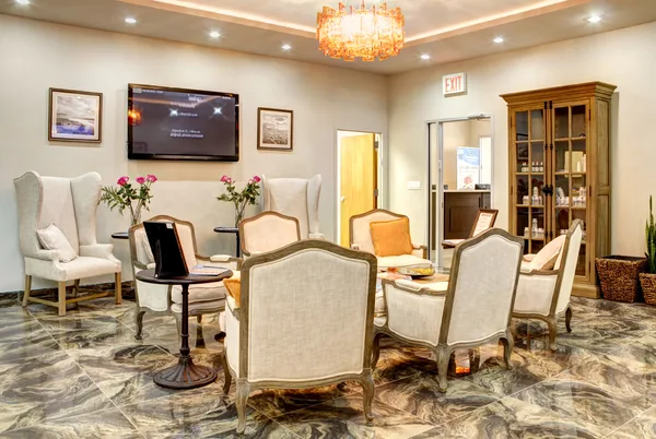 Private recovery room with recliner and soft lighting