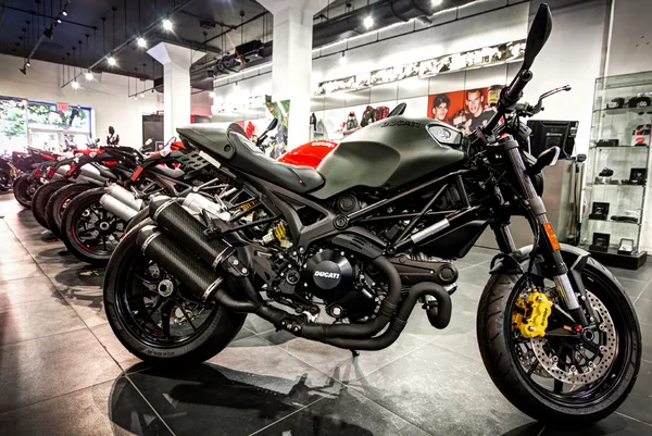 Adventure bike positioned near the dealership entrance