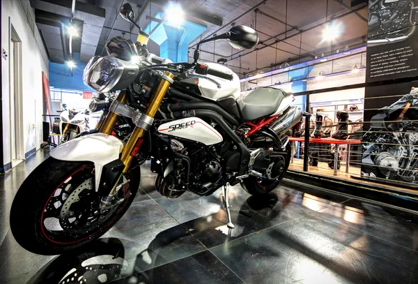 Bikes staged in a V-formation across the sales floor