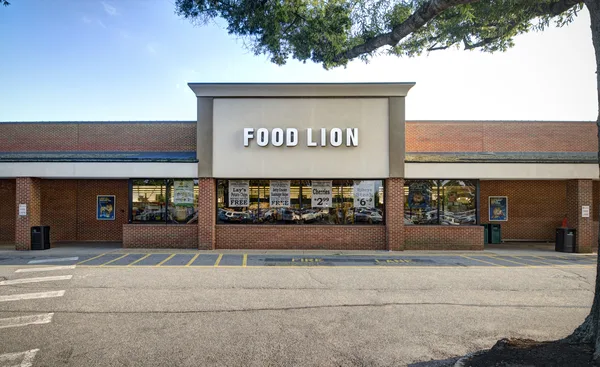 Sunset exterior across the full retail strip